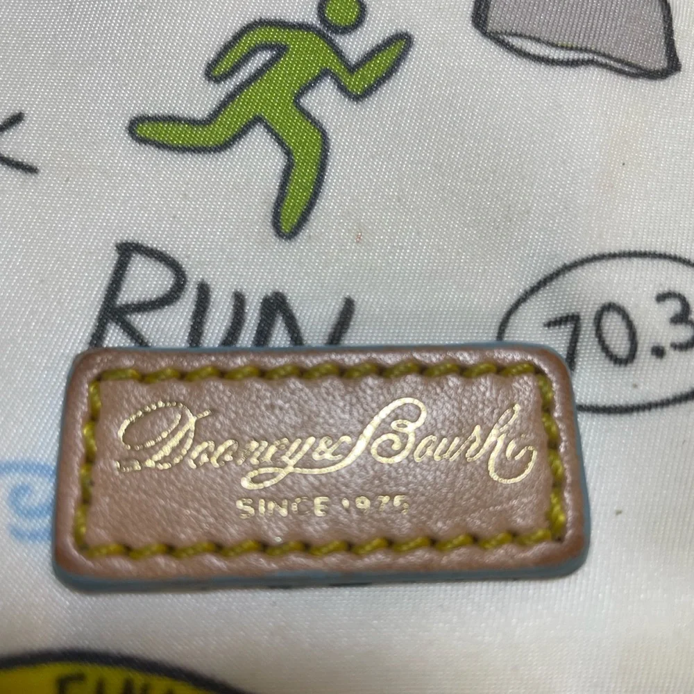 Dooney & Bourke Disney Sketch Marathon Wristlet 70.3 Run is a small wristlet